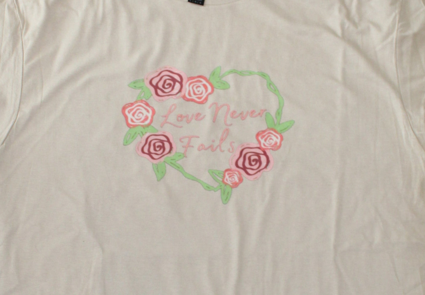 “Love never fails” Flower Heart short sleeve t-shirt